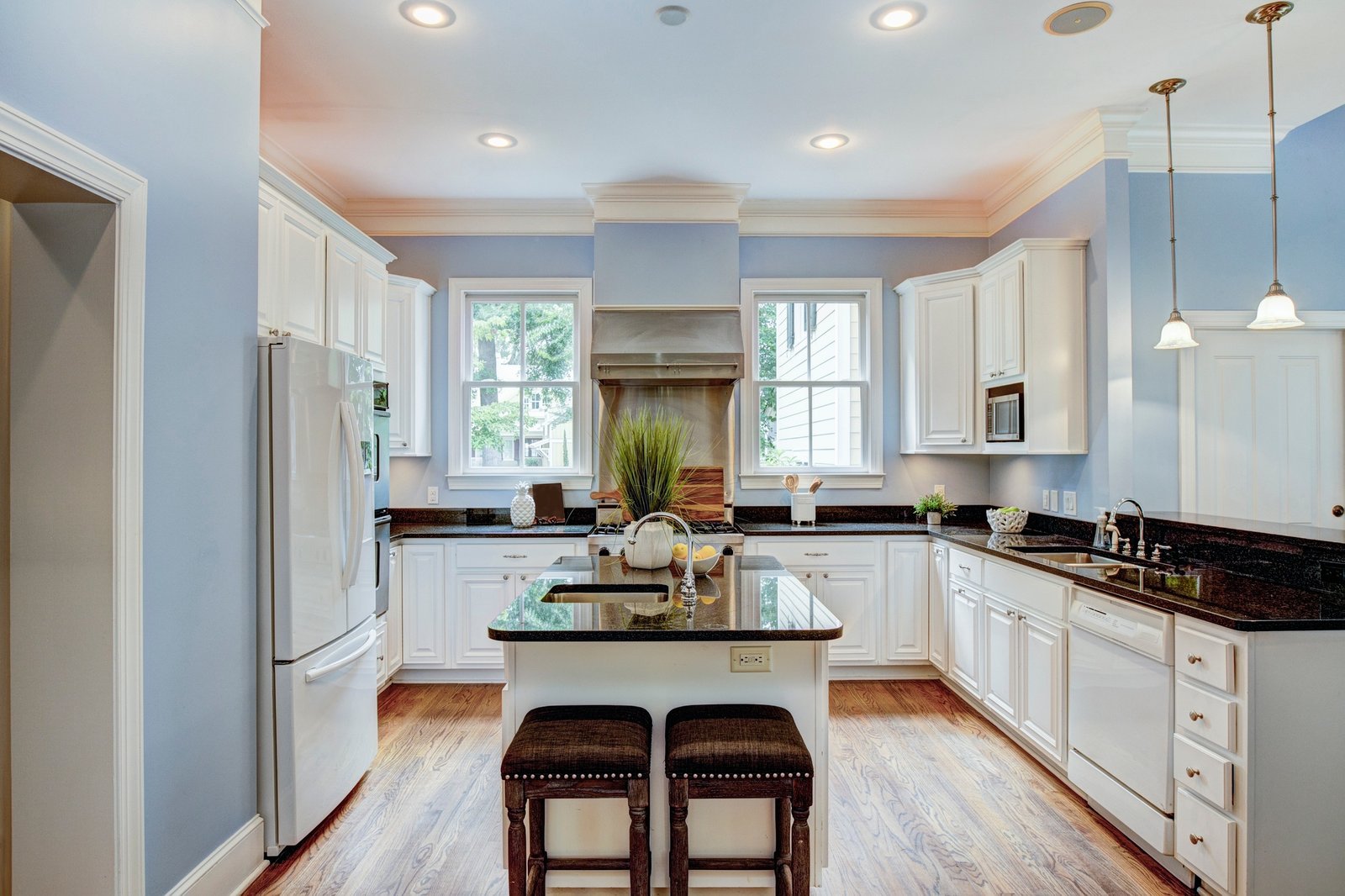 Large American style kitchen interior with granite countertops