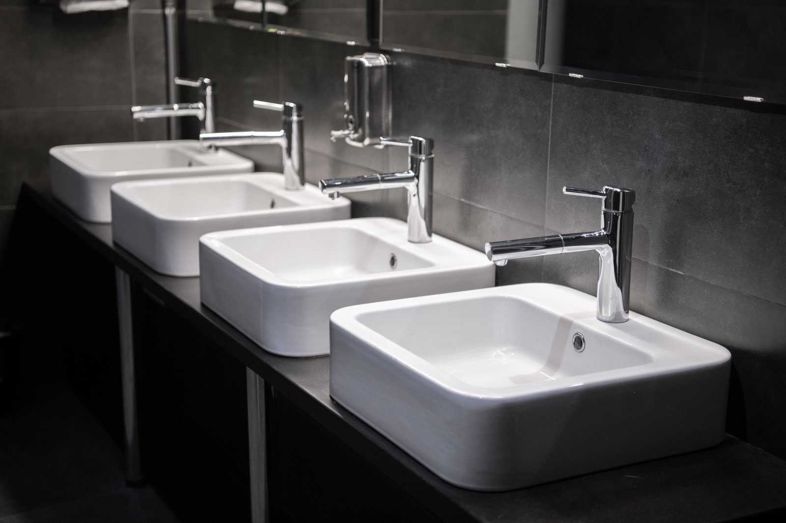 Modern sinks with mirror in public toilet